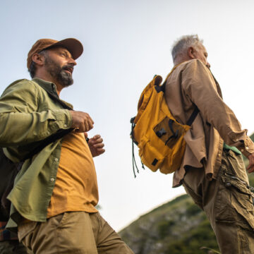 Die Analogie zu Coaching: zwei Bergsteiger hintereinander. Hinten der Coach, der den Patienten führt, vorne der Patient.